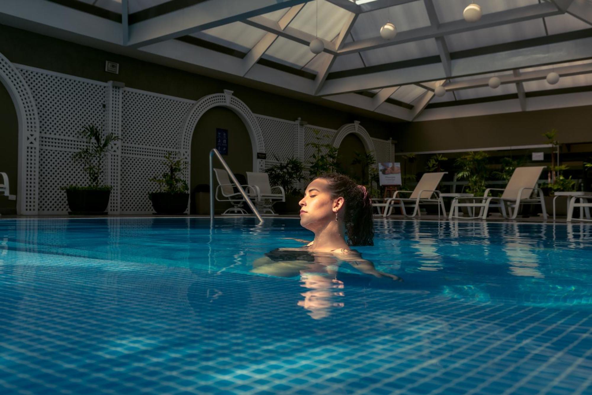 Casa Andina Premium Miraflores Lima Exterior photo A woman swimming in a pool